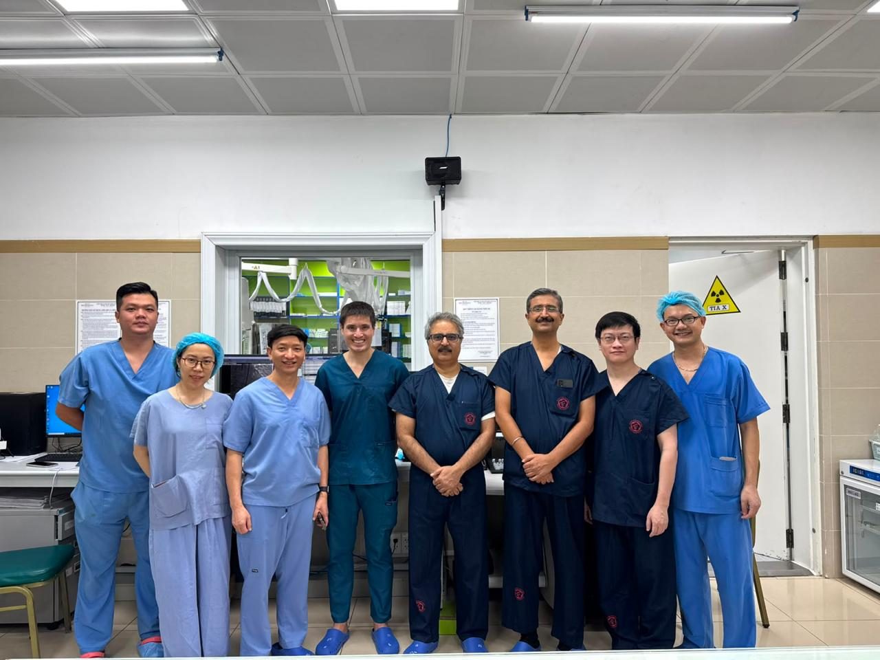 Dr Rajneesh Kapoor, Chairman of Interventional Cardiology at Medanta, with the heart team in the cath lab during his TAVR proctoring visit to Vietnam, October 2026
