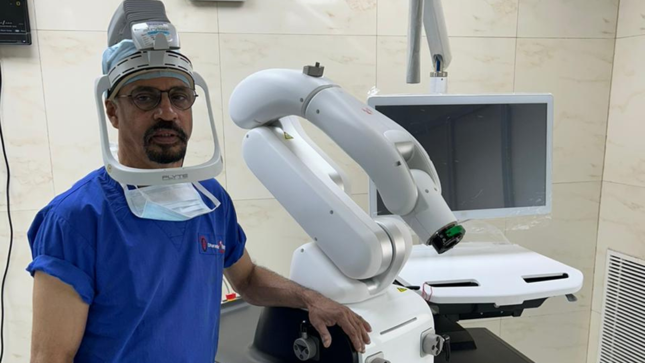 Dr. Murthy with the robotic surgical console before a procedure