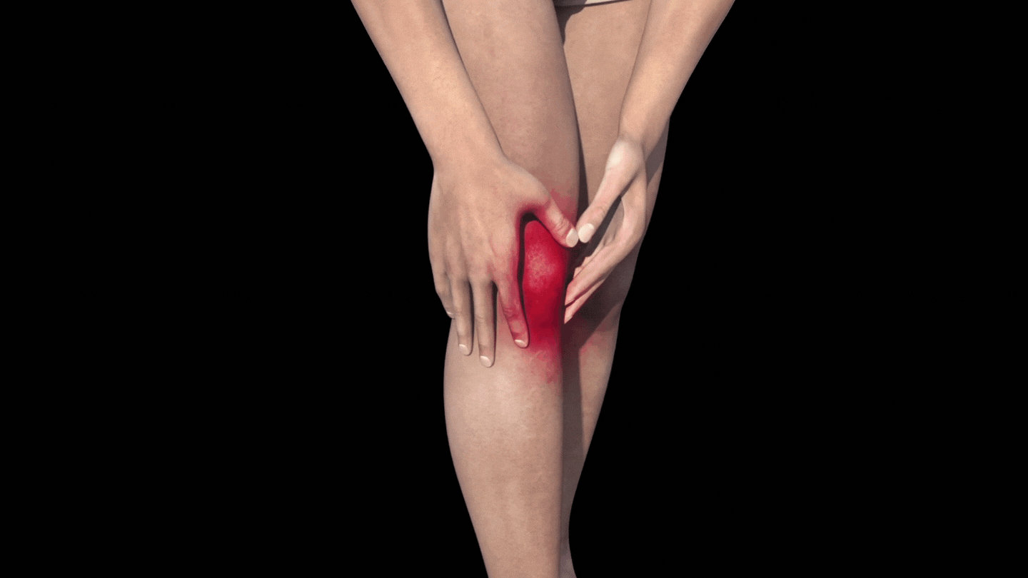 Person holding a painful knee